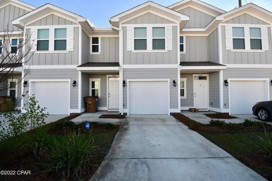 CURRENTLY UNDER CONTRACT, SELLER ACCEPTING BACKUP OFFERS -Currently a primary residence, this can be sold turnkey and rental ready FULLY FURNISHED by expert short term rental guru or take a $10k credit to furnish to your taste. This gorgeous 3 bedroom, 2.5 bath townhome features profile cabinets, original granite & Barnwood vinyl Plank flooring.  A smart home package is included with the home w/ Skybell doorbell camera, touch panel and KwikSet key-less entry. Sort Term Rental Allowed!!! It will be a perfect Primary Residence, second Home or vacation Rental. 3 Driveway Spaces + 1 Car garage. 9' ceilings down stairs with a kitchen pantry & fully fenced backyard with high end patio set. Plenty of storage and huge walk-in closet in master.  Right down the road from the Navy base, 5 minutes from the beach, 10 minutes to Pier Park, and surrounded by a plethora of EXCELLENT local food