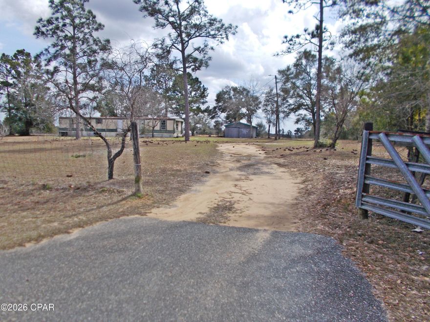 Very nice 7.3 ac on a paved road just outside of Sunny HIlls subdivision. this property is mostly cleared with a small 2 ac patch of woods on it seller says has a stream on it. the well has been tested and works; there is also a 2/2 mobile home on it that was lived in until about 5 months ago. it needs some work on it to include flooring, and is being sold ''as is'' the value is mostly in the land and improvements. There is a metal 17x30 storage building on the property and the land is mostly fenced. It would make an ideal mini farm. There is a title to the mobile home.
