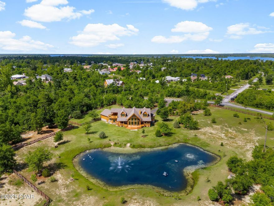 'CURRENTLY UNDER CONTRACT, SELLER WILL CONSIDER BACKUP OFFERS' 

Welcome to your dream retreat—an immaculate, custom-built true log cabin, inspired by Tennessee craftsmanship and nestled on nearly 10 acres of serene, private land. Built in 2020, this 2,762 sqft masterpiece showcases impeccable attention to detail and offers a peaceful lifestyle surrounded by nature, yet close to modern conveniences.

Step inside and be captivated by the 20-foot floor-to-ceiling wall of high-impact Andersen windows, flooding the open-concept living space with natural light and offering breathtaking views of your private pond. Nearly every room in the home offers tranquil water views, creating a calm and airy atmosphere.

This 3-bedroom, 3.5-bath home features a main-level master suite complete with a double-sided fireplace, soaking tub, glass-framed shower, and dual vanities. Upstairs, you'll find two additional bedrooms, a cozy loft, and a private balcony—perfect for sipping coffee and watching the sunrise.

The open kitchen boasts custom cabinetry, a double oven, spacious breakfast bar, and a walk-in pantry. Entertain effortlessly indoors or out, with large front and back porches, a custom firepit, and beautifully landscaped grounds.

Outdoor features include a Creek running through the back of the property, Private pond fed by a solar well, with a variety of Ducks to greet you, Over 1,000 feet of wired crossbuck fencing and fenced areas for donkeys, ducks, geese, and chickens, Quarter-mile of private trails, with room to expand, RV station with water, sewer, and dump connection, 13-zone irrigation system, including a zone to the pond, Rain gutter system routed underground to the pond, 400 amp service available, Water softener and filtration system, New roof (under 2 years old, under warranty), Fenced and gated paver driveway

Located just 2 miles from Deer Point Lake boat ramps, this property offers privacy, functionality, and a rare connection to nature. Whether you're looking for a full-time residence, weekend getaway, or a potential income-producing investment, this stunning log cabin is a must-see.