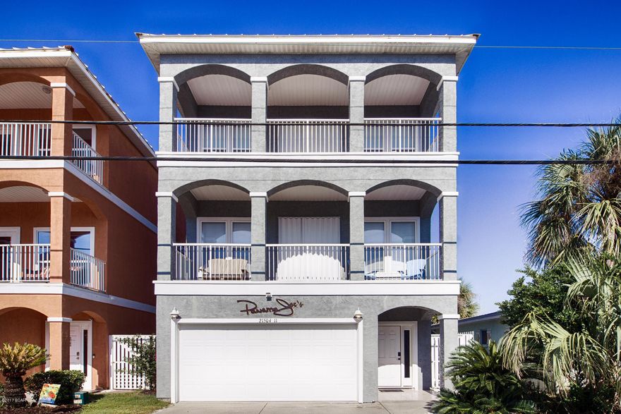 3 story completely remodeled beach home with Gulf views and lakefront. Maximized for rental income or ready to bring your bathing suit and suntan lotion as a second home. Balconies and deck afford panoramic lake and Gulf views. The entire 3rd floor is the master suite with it's own balcony sitting area and large walk in closet. Versatile room on first floor is both game room and bunk room. Call today for your private showing.