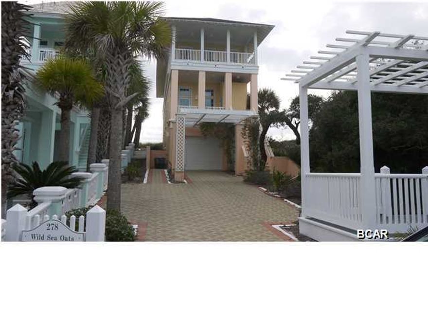 Architect Gary Justiss designed this beach front home to have everything you would want in a classic beach cottage - 1''x6'' tongue in groove wood walls, cathedral ceilings on the top floor, spectacular Gulf of Mexico views from the living/dining/kitchen and master bedroom areas, fireplaces in the living room and master bedroom, double loaded porches on the front and back of the home and so much more. The home has three bedrooms and 3.5 baths along with an elevator, a garage, and wonderful views of Lake Powell and Camp Helen off the north side balconies.  The construction is poured-in-place concrete on the lower levels and 1''x6'' frame on the top level of the home. Stucco, Hardie plank siding, and Hardie composite slate roof make this beach home low maintenance.