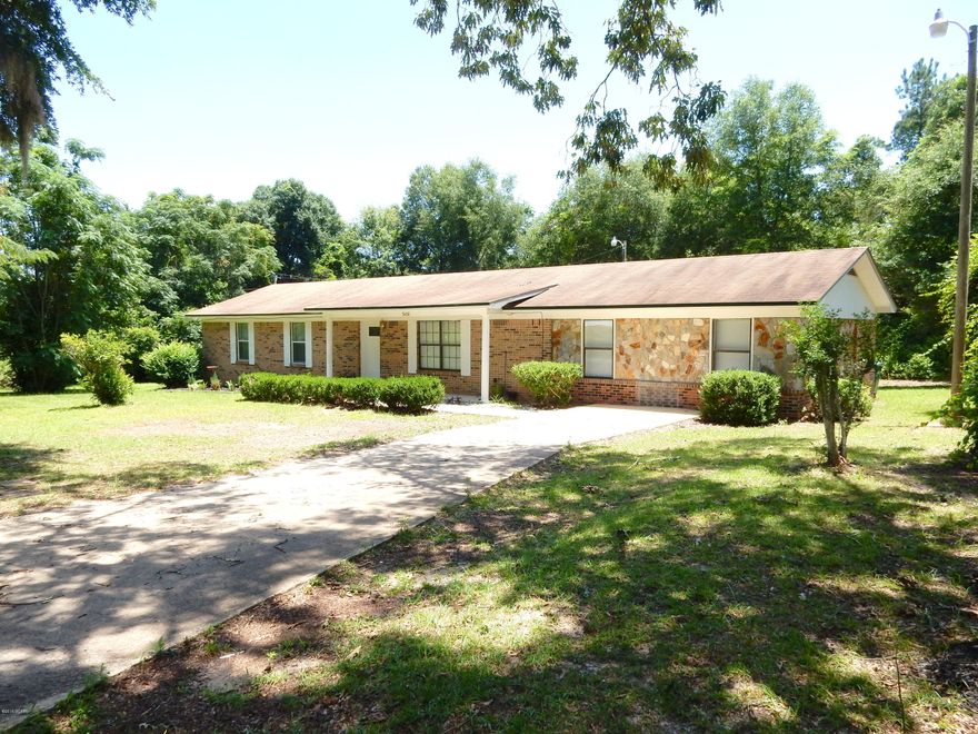 This MOVE-IN READY, newly renovated 4/2 Brick home features Updated Kitchen (new appliances convey) and Bathrooms, the addition of the Fourth Bedroom and den, updated flooring and electrical, A/C and septic serviced. This house has an open floor plan with plenty of room for family, an abundance of storage, and is located on just over an ACRE, minutes from town and A-rated Graceville Middle/High School. The big jobs are done, just move in and customize! Plenty of room for a pole barn/workshop and a big deck out back. ***Motivated Sellers, make an offer!