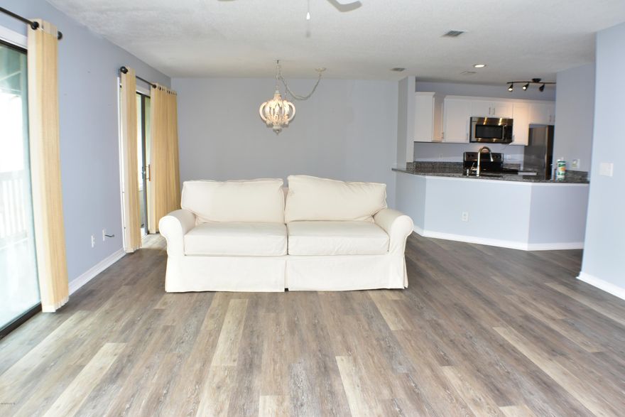 CURRENTLY UNDER CONTRACT, SELLER ACCEPTING BACKUP OFFERS.  Seller Financing Available!  This Villas at St Thomas unit has 2BR/2BA and has been upgraded in the last year with all new flooring, granite counters, light fixtures and kitchen cabinets!  From the private balcony you can enjoy the view of the pond and water feature and you're just steps from the pool, tennis courts, day dock on Grand Lagoon and nearby dining establishments.  This is a gated community near the beach and would make a great second home or rental investment!  All info is approx and must be verified by Buyers if important.