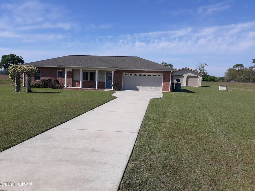 Nice brick 2 bdrm2 bath home on 5 acre's on private lane. Has new wood plank floors throughout except bdrms has new carpet. Has double garage detached in back of home along with a double garage attached to home. lot has fence around the 5 acre's and chain link fence around back yard. Nice family home large kitchen.