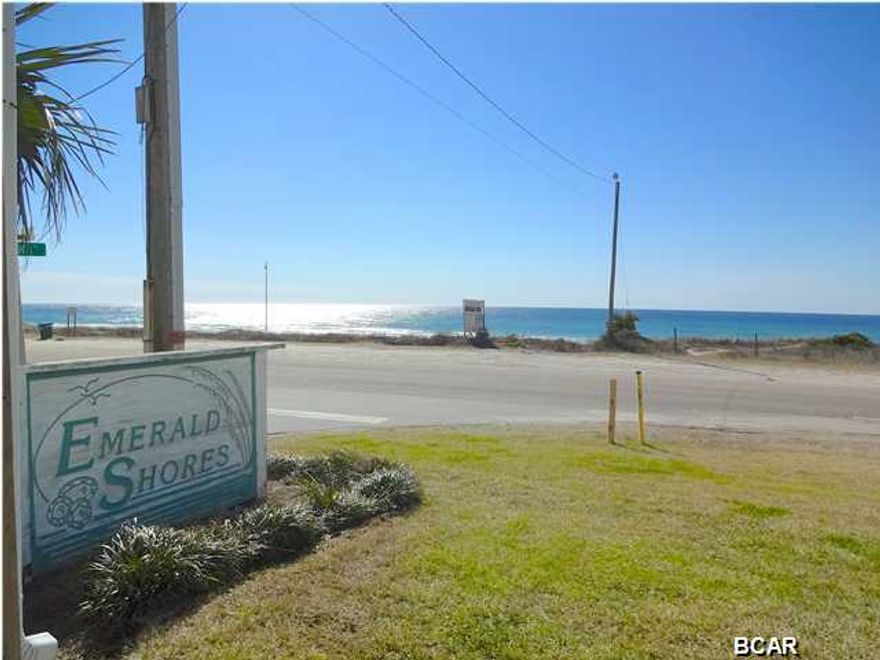 WOW! WHAT A VIEW! This unit is a 1 bedroom with hall bunks. It is located next to the local grocery store ''The Carousel'' down the street from the local's favorite hangout ''Thomas Donuts''; 5 minutes from Pier Park; 10 minutes from 30A. Emerald Shores is a quaint 3 story Condominium with a pool. Awesome location. These units rarely come on the market so don't miss out.