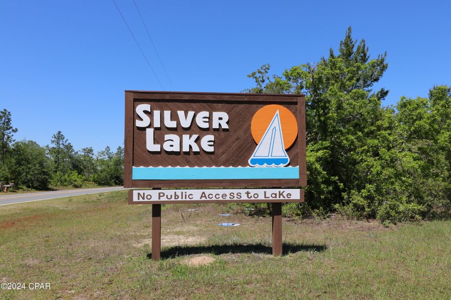 Check out this Rare and Amazing Opportunity to own 44+ acres with around 1632 ft. frontage on Hwy 167 and around 2211 ft. frontage on Lake Dr.!  Located at the entrance in Silver Lake, this gorgeous parcel has all the natural trees and foliage indigenous to NW Florida and waiting for you to make your vision come true! The possibilities are endless, maybe have it rezoned for commercial use, divide and develop or sell lots, or keep it all for yourself and build your Dream Home! Silver Lake offers access to the main lake, Silver Lake, only to owners and their guests via a recreational parcel. With access to an estimated 321 acre Beautiful Spring-Fed, crystal clear lake the amount of enjoyment is endless! Enjoy swimming, boating, kayaking, fishing, paddleboarding or even sailing! This lake does not allow any gas powered motors so the lake is pristine! All the serenity and beauty this area has to offer and NO HOA!! Location is within a short driving distance to Marianna as well as Panama City & Panama City Beach! Don't wait, call you favorite Realtor today and go see this beautiful parcel! Thank you for considering this property. All information should be verified by buyer or buyer's agent.