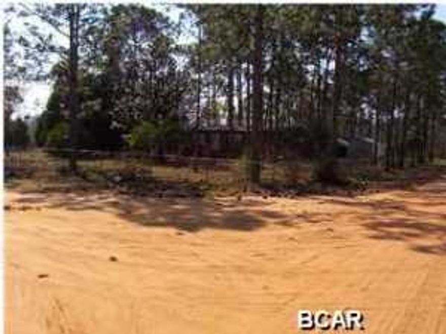 This large vacant lot is on a corner location, with a chain link fence. Caravana Manor was built in 1950's as an RV Park, (so it takes 2 lots to build a home or replace with new modular homes). This area is mostly modular homes, but a few newer single family houses have been built in the subdivision. Currently, this lot has a 1982 mobile home, which has been vandalized (copper wiring, heater and A/C stolen). Unit has been boarded for safety and has no value. Roof was replaced before this owner purchased in 2005. Sellers have never resided in property. You could place four single wide's and divide property or large lots for two homes or doublewide. Utilities in place but not used since 2005. The 1982 mobile home has no value. This listing is for the sale of the vacant lot only.