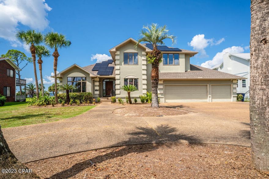 Waterfront home with 6 bedrooms and 4 full bathrooms in highly desired Kings Point neighborhood! Has 3 car garage with circular driveway. Back patio has motorized solar shades and outdoor kitchen built in 2021. Dock with jetski and boat lift. House has solar panels installed in 2021. Quartz and marble countertops throughout the home!