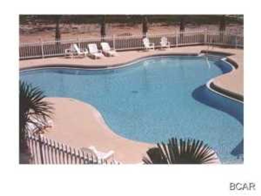 If you want turnkey, upgraded, nice and ready to go here is your home! Great centralized location in the heart of Panama City Beach. You will never be bored in the active Palm Cove community! Down the street from the beach, this subdivision features gated entry, two community pools, and even a volleyball court! This cute townhouse is over 1400 square feet under air with three nice sized bedrooms. Upon entering you will see a spacious living room with tall ceilings, nice large neutral tile in the living room and wet areas. The whole place has the feel of beachy, open and airy, with lots of light. The kitchen is above average in size with a nice pantry. The laundry room is located on the first floor.