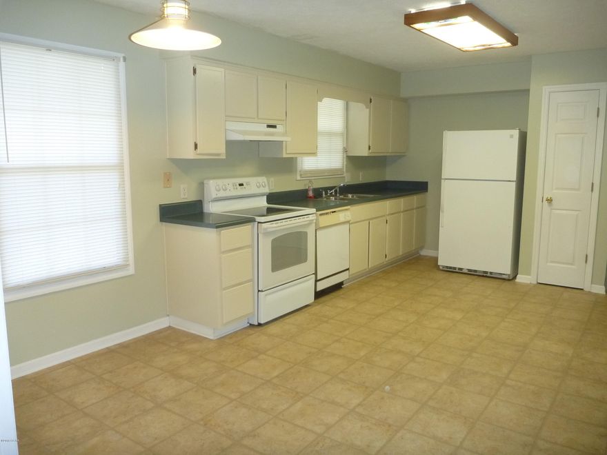 LARGE LOT IN QUIET NEIGHBORHOOD UNDER $150K! Split bedroom plan, this home also offers large bedrooms, large eat-in kit w/pantry and a fireplace in the living room that has a vaulted ceiling! MBR also has vaulted ceiling and access to the covered back porch (as does the LR). MBA has a HUGE walk-in closet that accesses a big laundry room! So convenient to your pile of dirty laundry!! 

Vinyl/laminate flooring thru-out. The 2 additional bedrooms share a full bath. Natural gas available. Dryer, Stove and patio are all plumbed for gas if desired. Spacious backyard is fenced and has a 12x16 storage shed/workshop that has elec.

Age, sq ft, room and lot sizes are estimates, please measure if concerned.