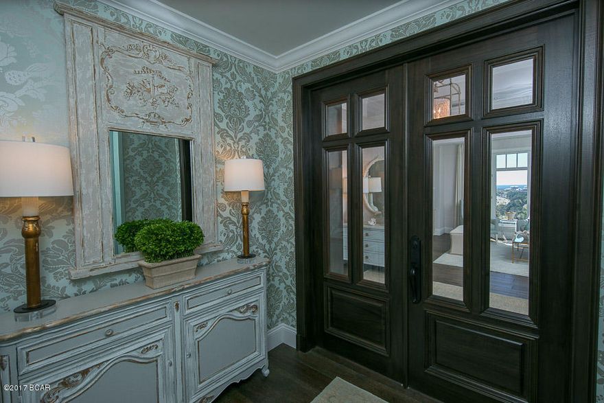 Inspired by beautiful homes gracing the cover of ''COASTAL LIVING'' magazine, the excitement begins the second you enter this custom residence. Remodeled in 2016 with care and pride, applying the finest materials, from the ''African Sapele Mahogany'' front doors of your private entryway, to the imported marble flooring in all three baths and kitchen. The Master Bath has Carrara marble counter tops, and the guest baths have high end granite counter tops. The Gourmet Kitchen with ''WOLF/SUB ZERO'' appliances compliment the the custom cabinetry made to fit around the new appliances with no fillers. Premium ''Buckskin Oak'' hardwood floors take you from the private entryway, into the Den with floor to ceiling built in library/book shelves and an electric fireplace, adding that perfect touch. From the 14th floor of One Water Place, you can see 7 miles to the North across Choctawhatchee Bay and sweeping Gulf views of the Eastern and Southern Coastline, stretching miles. Being on the Easternmost corner of Tower 1, offers incredible sunrises, no matter what time of year. The afternoon sun does not hit the property directly, allowing for maximum comfort during the Summer months as well as a great reduction in utility usage.

The Summer Kitchen, located on the 600 square foot rounded balcony has been completely rebuilt from scratch. The use of Titanium Powder Coating for all the doors, hinges, trim and side panels will help avoid erosion stemming from the elements. Granite Counter tops, New Sink, high end Grill by "Delta Heat" ,Ice maker, and multi use outdoor fridge, frame the outdoor kitchen area, for a true custom look and feel. 

All of the windows throughout the residence have remote controlled window treatments that blend into the trim and offer shade when down. The audio equipment is truly state if the art. The ceilings of the unit were completely redone, to offer not only a clean look, but clean wiring for optimal high speed wi-fi and audio throughout the 3220 square foot condominium.