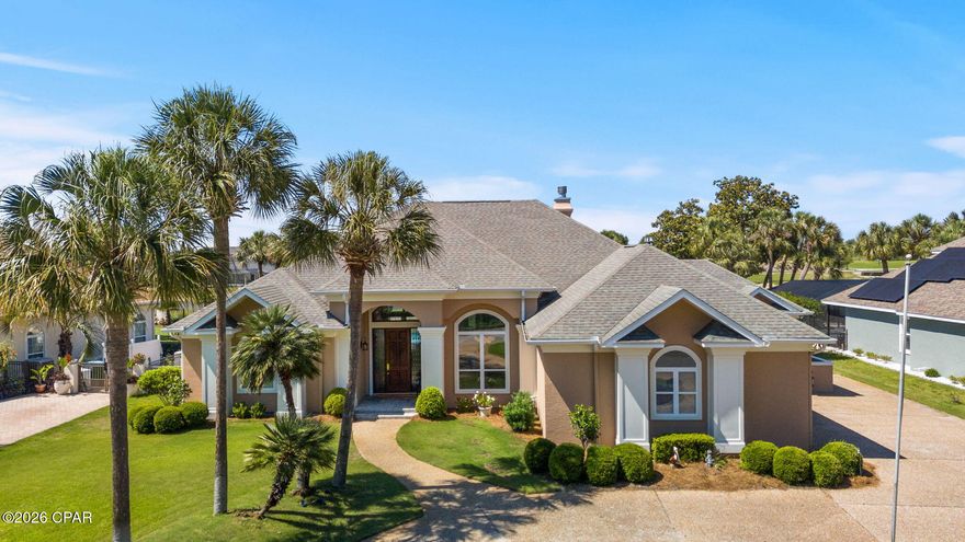 Nestled within the prestigious Queensberry neighborhood of Bay Point, this pristine 3,055-square-foot estate offers a masterclass in upscale coastal living. From the moment you pull into the expansive circular driveway, the home's grandeur is evident, highlighted by soaring 14-foot ceilings and high-end crown molding that flow through multiple light-filled living spaces. Recent premium upgrades ensure modern comfort and peace of mind, including a newly renovated primary bathroom (2025), fresh interior paint, and a suite of high-end appliances replaced between 2022 and 2024. Practical luxury is woven into every detail, from the built-in bookcases and gas fireplace to the expansive laundry suite that effortlessly transitions into a home gym or craft room.

The heart of the home is a chef's dream, featuring a farmhouse sink, gas stove, and custom cabinetry equipped with pull-out organizers. Designed for both functionality and charm, the residence boasts smart conveniences like power window shades, a central vacuum system, and floor-integrated outlets for seamless furniture placement. Seasonal decorating is made effortless by a specialized front-porch timer for holiday lighting, while the exterior is fully fortified with hurricane fabric and shutters. With a three-car garage providing ample storage and one of the two HVAC units replaced in 2022, every mechanical and aesthetic detail has been meticulously maintained.

The outdoor experience is truly your own slice of paradise, situated perfectly between the 10th hole and 11th tee box of the Legends golf course. The backyard sanctuary features a heated in-ground pool with a tranquil waterfall--newly resurfaced in 2024--surrounded by professional landscaping and breathtaking views. Whether you're watching a family of deer graze on the green at dawn or enjoying the glow of the 2023 exterior lighting at dusk, the atmosphere is one of total serenity. Tucked away from the city's hustle yet just minutes from the white sandy beaches and local amenities, this home offers the rare balance of an established, quiet community with world-class leisure right at your doorstep.