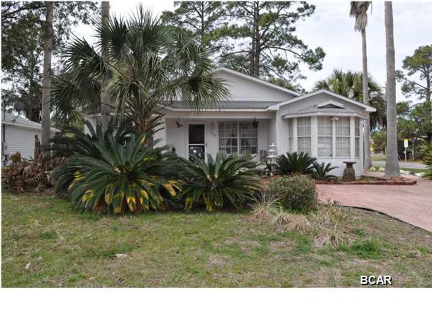 Charming cottage on a corner in the St. Andrews area. This home has been recently updated and includes three bedrooms, two full baths, and an open-floor plan with marble floors in the living area and two bay windows. The backyard is a privacy-fenced tropical oasis with a water feature. There is a workshop with lean-to that can be accessed from the side street through a gate; this feature is perfect for parking a boat or jet skis. There is also a tool shed for an added bonus. If you've got young children, you are walking distance to Lucille Moore Elementary School and for the older kids, Jinks Middle and Bay High Schools are only 5-10 minutes away. You're also convenient to St. Andrews main street and marina. This is a move-in ready home! All info is approx. and must be verified by