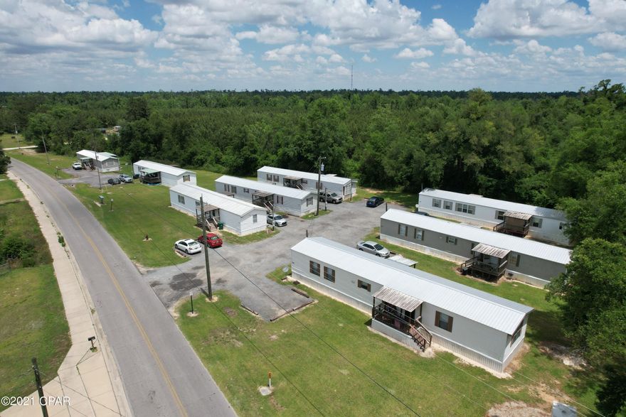 Established mobile home park for sale in a very good location.,  8 mobile homes with front and back porches titles to mobile homes and a survey of the property, all metal roofs all updated very good income. All presently rented.  There are 4 septic tanks.
