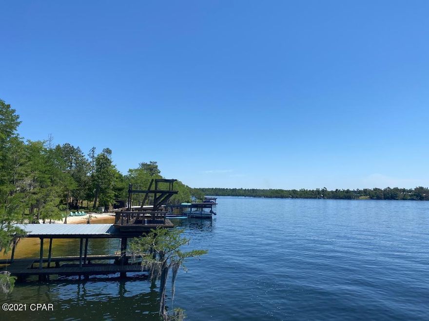 WATERFRONT lot on the big lake at Compass Lake.   This lot comes with a 2 story dock and a place to park your boat.   Well and septic already provided.   This is one of the premier ski lakes in all of Jackson County.  Located just north of Bay County and only 30 minutes from Panama City beaches.     Bring the family, build your dream home, Airbnb or just enjoy the dock and lake.   Call today for your appointment!!