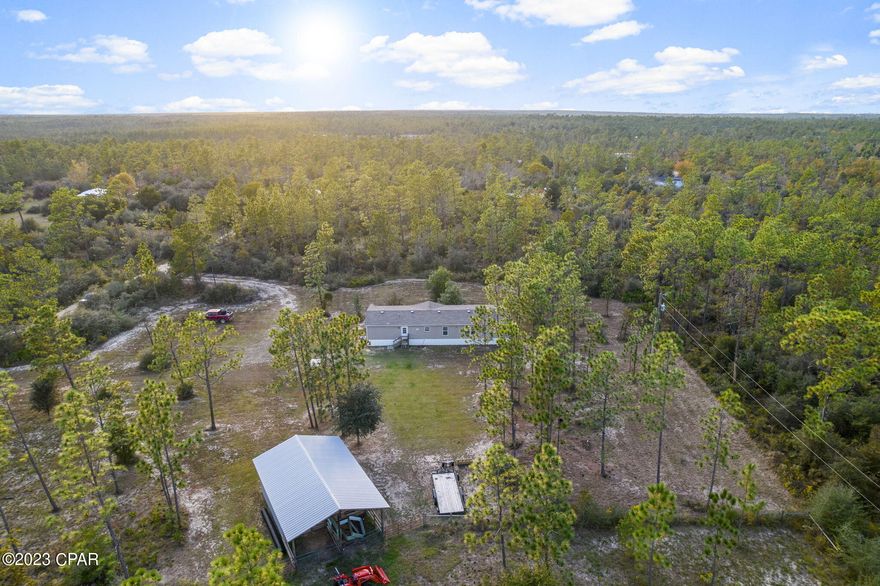 CURRENTLY UNDER CONTRACT, SELLER WILL CONSIDER BACKUP OFFERS.   Peace and quiet on 5 acres that are cross fenced and perfect for horses.  This 2020 4 bed 2 bath home has a beautiful open concept with large living room, spacious kitchen with island, dining area and a separate family room.  The master bedroom is large and the master bath has a soaker tub/shower combo along with a large walk in closet.  The other guest rooms are good sized and two have walk in closets.  The kitchen has a new dishwasher and stove along with a kitchen sink.  The washer and dryer come with the home.  The flooring in the living rooms and bedrooms is carpet but the kitchen and dining room is laminate.  There is an enclosed pole barn with a rolltop door and two covered stalls at the back.  Two fenced pastures are cleared and ready to use.  There is currently water at the barn, but no electricity.  Home is on well and septic.  The well pump was recently replaced and upgraded.  There are motion detection floodlights and a ring camera on the front and back doors that will stay with the home.  There are great neighbors nearby!  Make plans to view this beautiful home and property today!