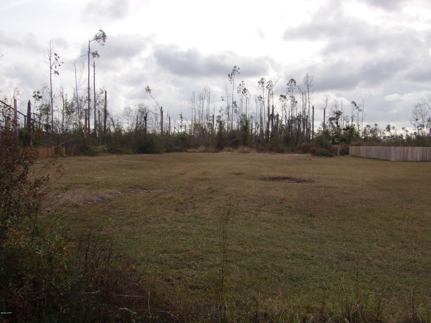 Large cleared lot on almost an acre. Zoned R-2  for residential single family or duplex. City water  and sewer available. High and dry close to schools, Tyndall Air Force Base H.G Harder's park and walking track.  All this lot is missing is you and your home.