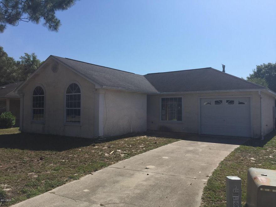 Attractive contemporary home on a cul-de-sac location convenient to Tyndall Airforce Base and Panama City. The home features a split bedroom floor plan with vaulted ceilings with the focal point being the spacious living area with a contemporary gas fireplace and vaulted ceilings. Master bedroom is large and has his/hers closets. Plenty of storage with a kitchen pantry, 2 linen closets, a coat closet additional garage storage. Bathrooms have solid surface counter tops, sky-light in the guest bath, and tile flooring.  Garage

has been partially converted into an extra large, finished laundry/storage room, with a door accessing a workshop.