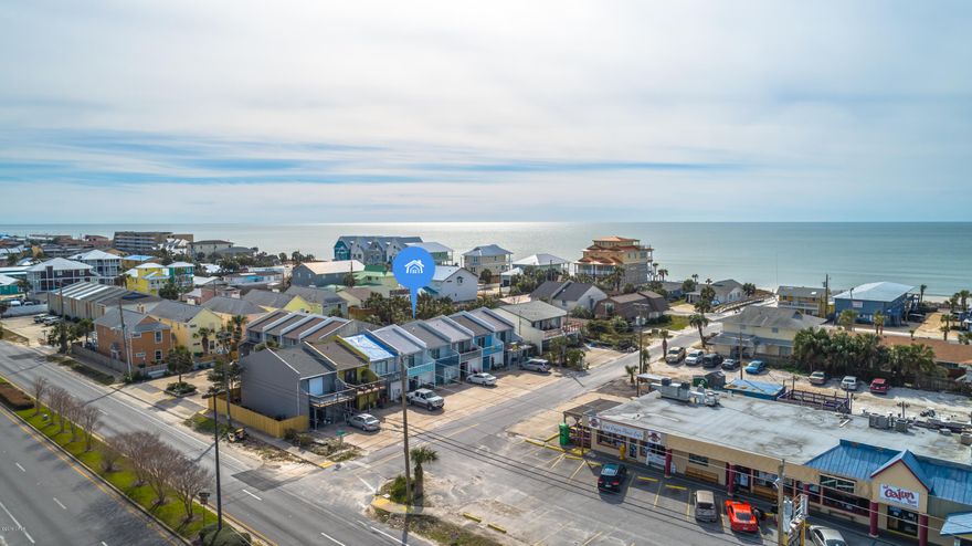 100 Steps to the Beach and NO HOA FEES! This is one of the best deals on the beach! New paint, flooring and of course a new roof! Just mild shingle damage from the hurricane but owners replaced the roof anyhow. No interior damage and is move in ready. Remodeled two years ago and has been a great rental for the past two years. Records available. This is a very special unit because there is no flood insurance required, its just steps from the Gulf on the South side of Thomas Drive and best of all NO HOA dues!  Check ot the pics and make it on your list of units to see this weekend. Two bedrooms, large master, open floor plan downstaors. Vacant and ready for occupancy!