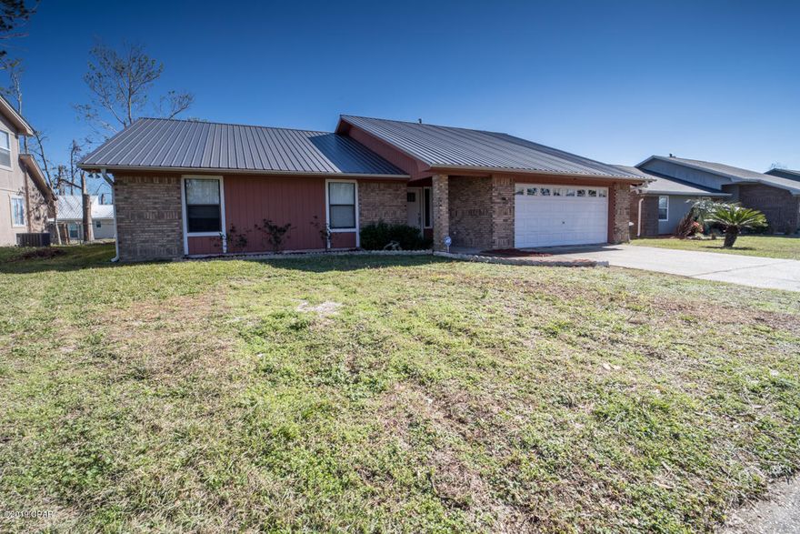 Beautiful well maintained brick house with many upgrades located in a quiet neighborhood close to Tyndall AFB and the bay. Spacious house with newer floors, charming archways, paint and fixtures. The huge master bedroom with tray ceilings, large closet and newer bay windows make it a perfect hideaway.  Enjoy your morning coffee sitting in the breakfast nook with double pane Bay windows or the screened in back porch. The large living room is open to the amazing mirrored ceiling dining room, kitchen and screened porch. The immaculate kitchen with newer counter tops, tongue and groove ceiling, beautiful track light and breakfast nook make this the place to hang out.  Don't worry about the roof (metal) and A/C-Heater, all were replaced less than 3 years ago. Child  & pet friendly fenced back.