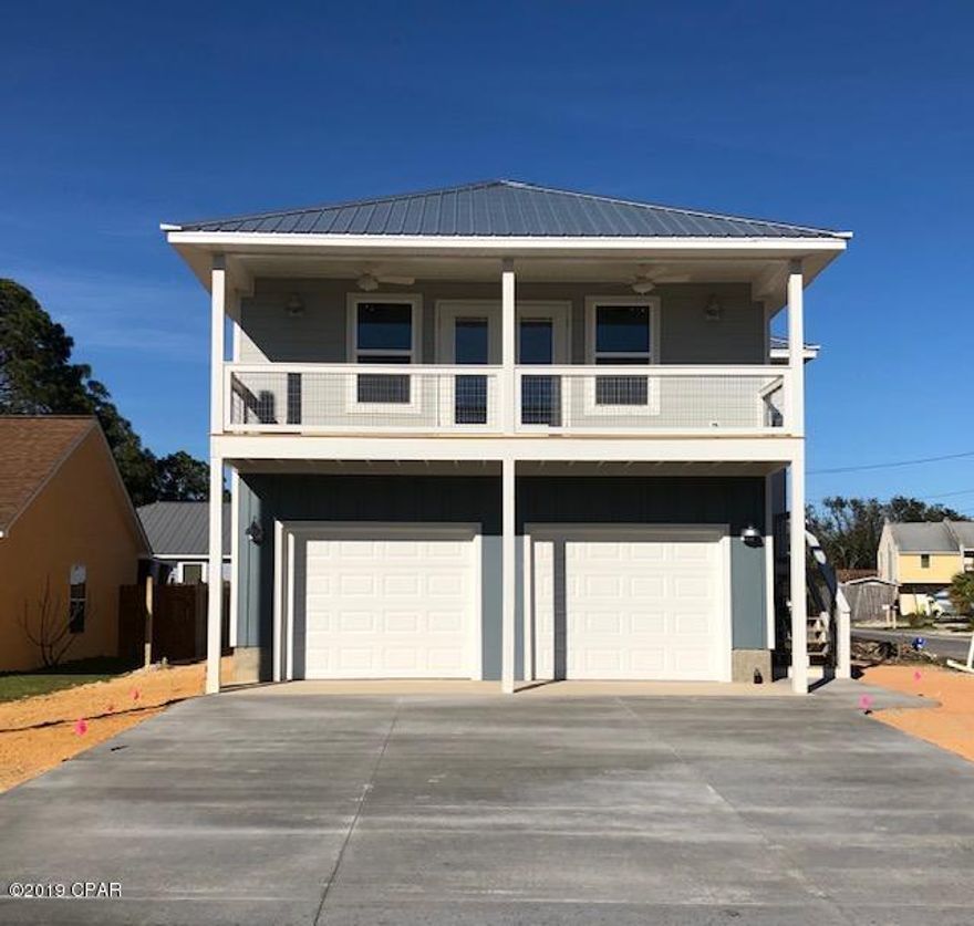 OPEN SUNDAY MARCH  10th 1:00 to 4:00 NEW CONSTRUCTION SOUTH LAGOON  BEACH HOUSE , almost ready for new owners! This craftsman home features hardie board construction and a metal roof on a great corner lot a block from the LAGOON. Bring your boat and golf cart for quick trips to the gulf or boat launch. The inside offers a light filled open floor plan that accesses a huge front covered deck, perfect for entertaining ! White cabinetry, a HUGE ISLAND, upscale granite , and top of the line BLACK STAINLESS APPLIANCES make this kitchen the center of the great room. The Master Bedroom includes a  fabulous fun deck with a peek a boo view of Grand Lagoon, and the bath offers a beautiful tile shower and double vanity. The outside includes a 2 car garage, privacy fenced yard and irrigation.