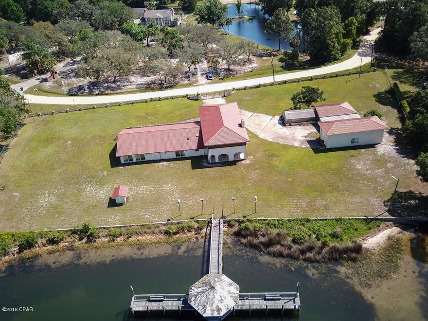 All sizes are apx////ESTATE SALE: REDUCED---REDUCED----REDUCED--- Seller will look at all offers---Ready for Closure!!!!Selling ''AS IS''--- Over 5000 SF Heat and cooled--2 Master Suites (1/and 2nd floor)--Elevator////huge family/piano room//back of home faces open bay---over 295 ft on BAY--Navigable to Gulf of Mexico---Mansion--needs updating--gorgeous views from the boat dock---a must see!  Separate RV--Garage===Large Green House(needs work)  Large walkway and deck on water!!!