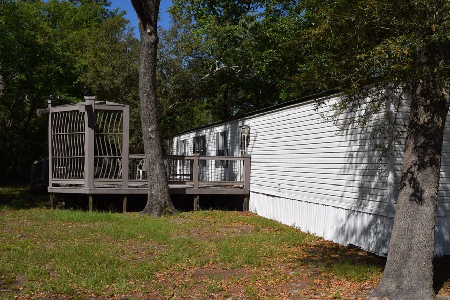 Come enjoy all a fish camp has to offer! Beautiful shaded lot with huge Trex board deck on the back. Also has a workshop! This could be your home away from home. This is a must see listing!
