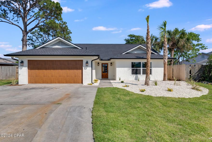 CURRENTLY UNDER CONTRACT. SELLER WILL CONSIDER BACK-UP OFFERS. Welcome to your dreamy new home in Seaclusion Beach! This stunning 3 bedroom/2 bathroom home has been completely renovated to offer the perfect blend of coastal charm and modern luxury. The bones of this home have also been updated to include a new HVAC, hot water heater, roof, and new electrical! 
As you step inside, you'll be greeted by vaulted ceilings that create an airy and spacious feel throughout the home. Natural light floods the living spaces through large windows and skylights. 
The heart of the home is the beautifully designed kitchen, featuring quartz countertops, an abundance of cabinetry providing ample space for storage, quality appliances, and a beautiful tile backsplash. If living space is what you're looking for, this home provides a vast living area open to the kitchen, the large dining room, and an additional bonus space that would be perfect for a playroom, reading nook, lounge area, or even a pool table! 
The master suite is complete with a luxurious en-suite bathroom with a gorgeously tiled shower, double vanities, a dressing area, and a huge walk- in closet. The two additional bedrooms in this home provide ample space for guests.
Outside, the spacious yard is perfect for entertaining, relaxing under the sun, or hosting cook-outs with guests. Ready to head down to the beach? This home has PRIVATE DEEDED ACCESS to Bidawee Beach only ½ mile walk or a golf cart trip away! Location is everything! This home is located on beach-side of HWY 98 making it a quick trip to the sun and the sand. Only 2 miles to Pier Park, 6 miles from the Hathaway Bridge, and 10 Miles to HWY 30A! Come check it out!