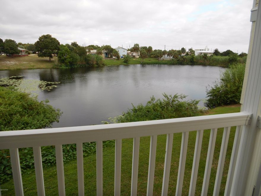 BANK OWNED FORECLOSURE * LAKEFRONT * LOCKOUT APARTMENT ON MAIN LEVEL * NO HOA FEES * RIGHT SIDE UNIT ONLY * This 4 bedroom, 3.5 bath home is located just 1150 FEET from the Worlds Most Beautiful Beaches. BEST VALUE ON THE WEST END.  could be used as a rental and has an owner ''lock out'' unit.