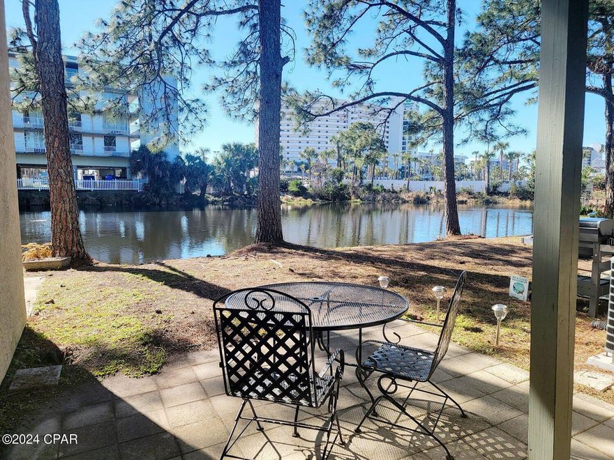 Discover your dream beach retreat in this fully furnished 2-bedroom, 1.5-bathroom townhouse located steps from the Gulf within a premier beach resort. The home comes with basic cable and internet included. Enjoy serene pond views from the backyard, modern stainless steel appliances, and meticulous care throughout. Schedule a viewing today and experience the perfect blend of comfort and luxury!