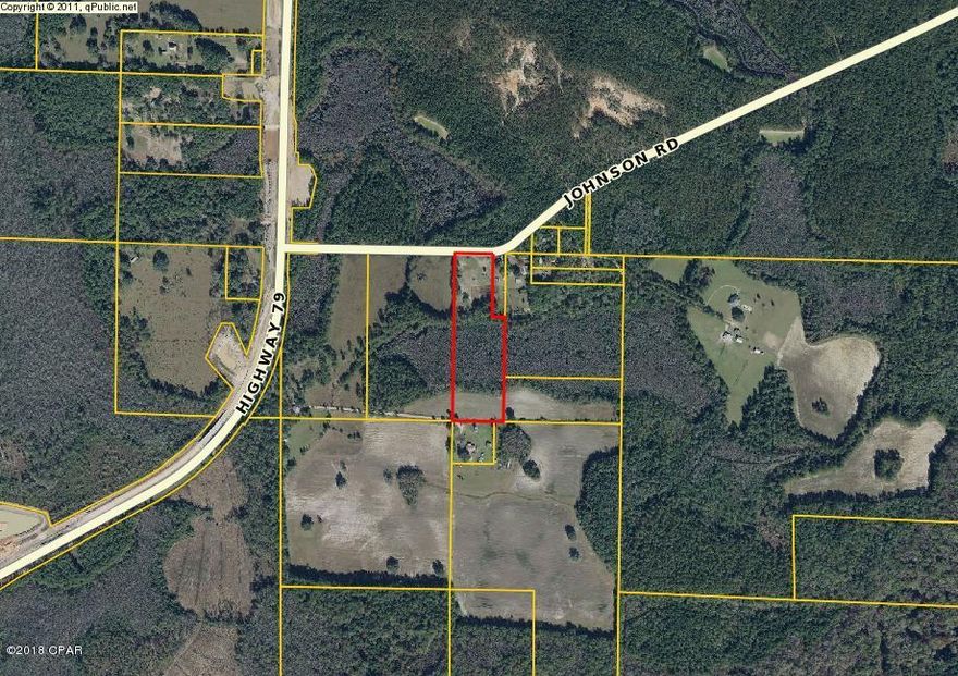 10.8 Acres land.  Mostly wooded. About half low lying. Lots of wildlife.  Short distance to town.