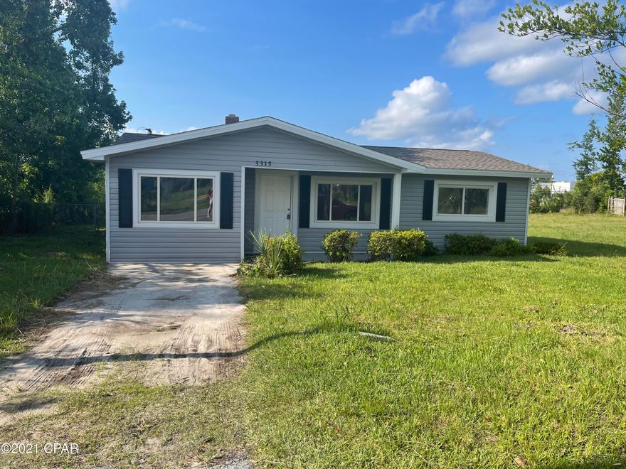 Under contract-taking back ups. Must see this adorable home! Its been totally remodeled and is ready to move in!  The kitchen has beautiful quartz countertops over white cabinets and brand new appliances.  The living room boasts a beautiful fireplace and is open to the kitchen. The bathroom has a tiled tub/shower combo.  There is a large bonus room off of the kitchen as well.  The lot that adjoins the property to the right is also available for $30,000.00.  All measurements are approximate and should be measured if important.