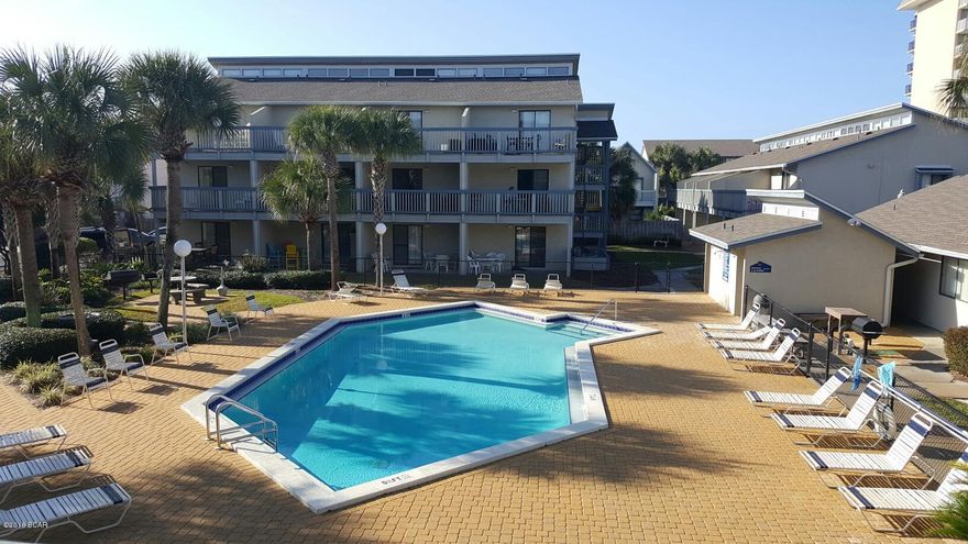 Second floor corner unit. Balcony overlooking the pool.