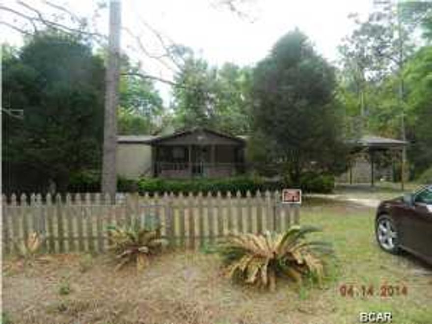 Cute mobile home in the desirable Kingswood area of Southport. With a little TLC, this would be a perfect starter home or investment property. There is a separate dining area just off the kitchen and glass sliding doors leading to your screened-in deck. Back yard is chain-link fenced. Property is located close to Hwy 388, which is a quick trip to Northwest Florida Beaches International Airport and Panama City Beach. Property being sold As Is. All measurements approximate, please verify if important.