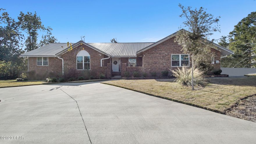 BEAUTIFULLY RENOVATED AND MUST-SEE HOME ON A LARGE CORNER LOT, convenient to St. Andrews, the bay, shopping, and downtown, has TWO living rooms, a wood-burning fireplace, additional half-bath, and a super functional laundry room with space for a home office tucked right in! Entertain (or just relax!) on the covered patio, and enjoy the privacy of NO NEIGHBORS on two sides of your fenced backyard. The attic and many spacious closets provide multiple interior storage options. Off-street parking for up to 8 additional cars (plus 2 in the attached garage) is a nice bonus any time of year. The in-ground sprinkler and well system will keep your fabulous landscaping looking great in all weather at no additional cost. You will fall in LOVE with the spacious floor plan and great design. COME SEE! Roof is new post-hurricane.  Home has spray foam insulation and a lifetime warranty from RamJack on foundation work.