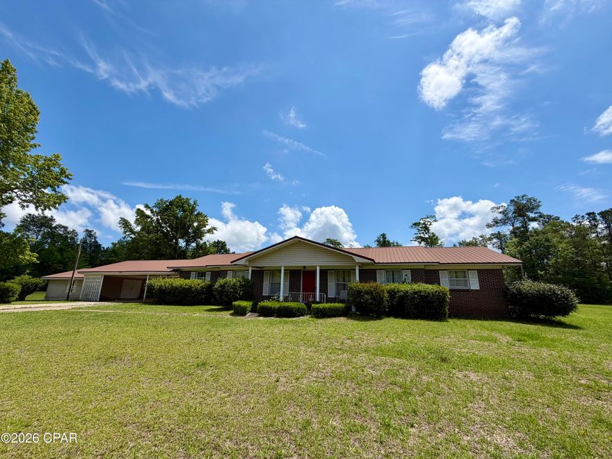 If you've been looking for a large home for your family, this is it!!  Check out this 4 bedroom, 3 bath brick home with 2,546 heated & cooled square feet situated on 2.62 acres! Features include a formal living room and dining room, den with built-in entertainment center and an additional room off the den with a freestanding wood-burning fireplace. The master suite offers a built-in desk, built-in chest of drawers, his and hers closets and a step-in shower in the master bath. Two of the additional bedrooms feature built-in desks, cabinetry and shelving. Outdoor amenities include a covered patio, huge storage room, pole barn, pump house with storage and dog pen. Updates include a water filtration system, roof replaced in 2019, water heaters replaced in 2022 and HVAC replaced in 2024.