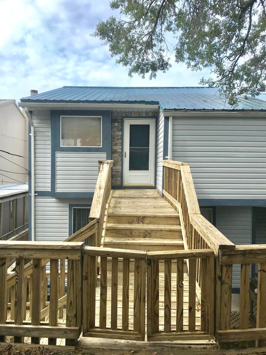 A VIEW AND AFFORDABLE TOO !!!  This townhome features three levels for your living enjoyment.  Directly off the street walk into your spacious, open living area with the kitchen and breakfast bar available.  Fireplace situated in corner and laundry room and pantry conveniently located on this floor.  Second floor features two big bedrooms with closets that are walk in and loaded with shelving.  The Third level is a ''diamond in the rough'' and would make an awesome second living room or a Man Cave.  The View is spectacular from all levels and there are balconies for even more enjoyment.  Take a look, it won't last long.