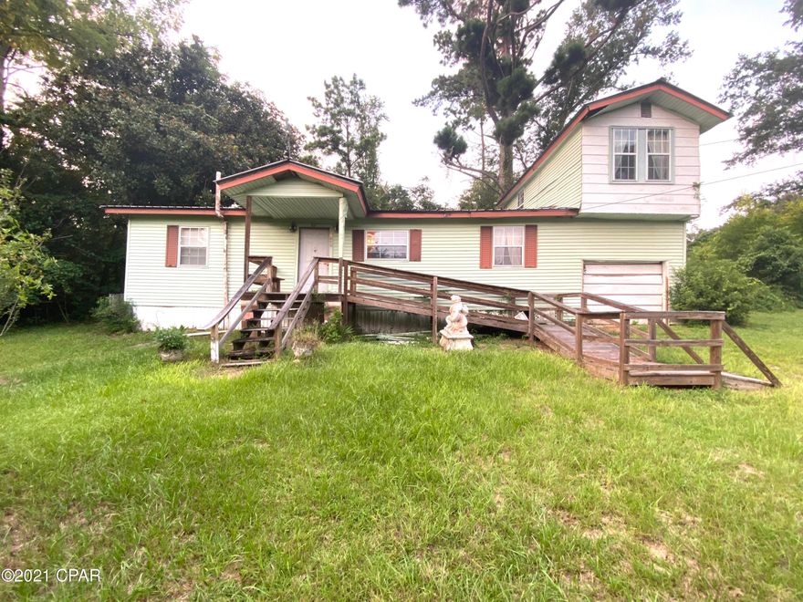 3 bedroom/1 bath fixer upper with a metal roof, central air, and propane heat sitting on 1 acre +/-  in the heart of Sneads just 3.6 miles from Lake Seminole and 2.7 miles from Three Rivers State Park! Needs a carpenter's touch for repairs/updates, but the square footage and location make this home a great investment! City water, sewer, and garbage.