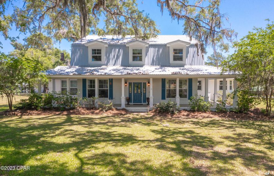 Welcome to Ancient Oaks Farm!  This is a 140 acre farm with over 400' of frontage on the beautiful spring fed Holmes Creek.  There is a 4420 sq ft home on the property.  It was built in 1988 but was completely renovated with a new chef's kitchen, the ultimate master bath, etc. within the last 5 years.  Kitchen features large island with seating area, granite and quartz countertops, farm sink, Thermador gas range and dishwasher.  Two eating areas plus formal dining room.   Travertine floors. 
 Wood floors throughout rest of first floor and staircase.  Great room features a floor to ceiling 2 story stone wood burning fireplace.   There are 4-5 bedrooms, office, formal dining room, and additional bonus living spaces such as nursery, library and more.  
 The master suite bath has a lovely clawfoot tub, separate custom Marble shower with rainhead and body sprays.  Besides the huge wraparound porch on the front of the home, there are open terraces on the back, screened porch, and cool fire pit lounging area.  There are very old heritage oaks framing the home on the property and approximately half the property is pastures and areas for riding and training horses.  The other part is wooded and is excellent for deer and other types of hunting and wildlife lovers.  There is a first class 8 stall horse barn, tack rooms and storage room.  Nice chicken coop, very large multi purpose barn.  There is a caretaker's home on the property, and more barns plus a really cool cypress cabin nestled way back in the woods close to the creek.  The beauty of having all this plus being able to go right down to your own private 400 feet along Holmes Creek and jump in with kayaks, canoes, paddle boards, relaxation and privacy at its best!  You've also got a large private pond to fish from, water on a large active creek, farm land, woods, lovely home, plus guest houses, live here and surround yourself with all this, or set up the most unique wedding venue or VRBO!  All within 45 minutes of PCB's World's Most Beautiful Beaches, Destin and 30A, and world class shopping and dining!