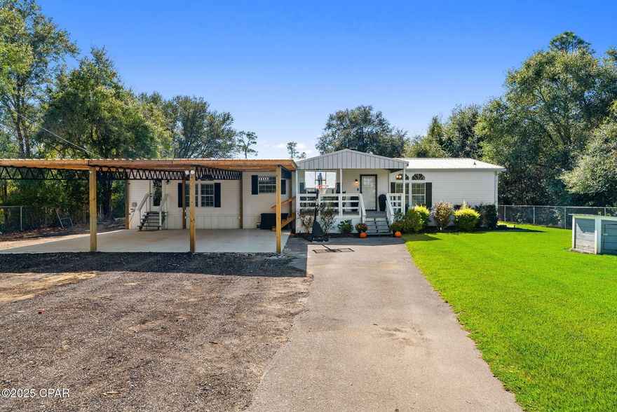 Nestled on just under an acre (.95 acres) in the peaceful Crystal Lake community, this beautifully maintained home offers the perfect blend of modern updates, functional space, and outdoor enjoyment. Whether you're looking for a full-time residence surrounded by nature or a relaxing second-home getaway, this property delivers comfort and charm at every turn.

From the front yard, enjoy breathtaking views of Crystal Lake, visible right from your kitchen sink, dining area, and the spacious front porch—the perfect spot to enjoy your morning coffee or unwind at sunset. The yard is immaculately maintained with lush Zoysia grass, mature landscaping, and plenty of room for kids or pets to play.

Step out back to your two-tiered patio, pool, and lushes yard, and fire-pit ideal for entertaining or quiet evenings under the stars. The backyard also features a beautiful mature oak tree, ample privacy from the trees on the property line, plus an adorable playhouse that adds extra charm and fun for little ones. Further back in the yard there's no shortage of storage or workspace here—with not one but 3 out buildings! 2- 24'x36' Pole barns with 100 amp sub panel ran with 220, 3/4 enclosed and 1- 20'x24'  half enclosed with power.
One with an additional 12'x36' carport lean to, both with more than enough room for all your storage needs, and a one car detached garage/workshop. All these additional spaces are perfect for boats, ATVs, RV's or outdoor gear. 
The property also includes a 30'x32' carport lean to for up to three vehicles in the front of the home, offering convenience and protection from the elements. 
Inside, the home has been thoughtfully updated with modern doors, flooring, and bathrooms, as well as updated appliances throughout. The large, open kitchen features an island, ample counter space, and plenty of cabinetry—ideal for family gatherings or entertaining guests. The utility room includes a large pantry with built-in storage, its own covered entry with lots of natural light right off the covered parking. 
The master suite is spacious and includes an additional adjoining bedroom, perfect for a nursery, office, or private sitting area. Making this split bedroom floorplan home practical for so many living arrangements. Situated on a county-maintained road, this home runs on well and septic, keeping utility costs low while offering the peace and privacy of country living—all just a short drive from shopping, dining, and the beautiful Northwest Florida outdoors. 

Additional updates include a new deep well pump installed by Culligan Water replaced less than a year ago, a new AC and wiring with smart thermostat replaced about a year ago, as well as a new septic drain field replaced and tank pumped last year.
 
How conveniently located is this property you ask? 
Northwest Florida Beaches International Airport (ECP) 16.5 miles away
Pier Park - Panama City Beach 27.9 miles 
Tyndall Air Force Base 30.2 miles