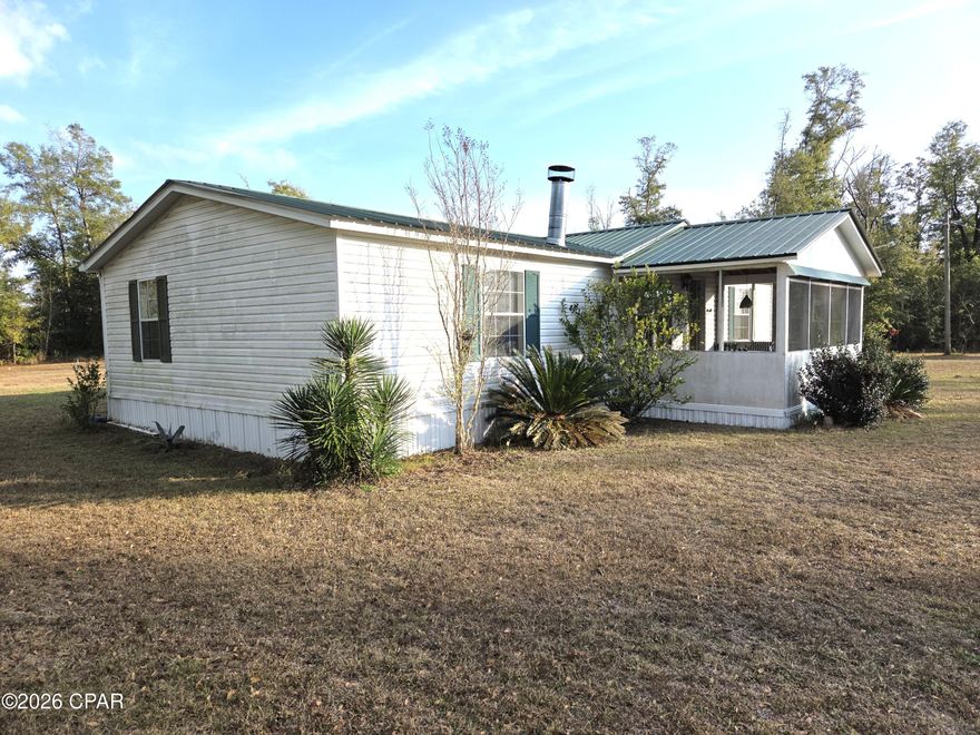 CURRENTLY UNDER CONTRACT, SELLER WILL CONSIDER BACKUP OFFERS. Welcome to your charming retreat at 17305 Northwest Creek Road in peaceful Clarksville, Florida! This inviting furnished home offers comfortable, move-in-ready living with a cozy wood-burning fireplace that sets the perfect ambiance for cool evenings and family gatherings.
Step outside to discover a classic white picket fence framing the front yard, adding timeless curb appeal and a touch of nostalgia. The property features a gated paved driveway for secure, convenient access and plenty of parking.
Nature lovers will delight in the abundance of fruit trees planted throughout the one plus acre lot.  Nestled in the serene countryside of Clarksville, this home combines rustic charm with practical comforts, offering a tranquil escape while remaining accessible to nearby towns and Florida's beautiful beaches. Ideal for those seeking a peaceful lifestyle with all the essentials included.
Don't miss this rare opportunity to own a turnkey slice of Florida paradise!