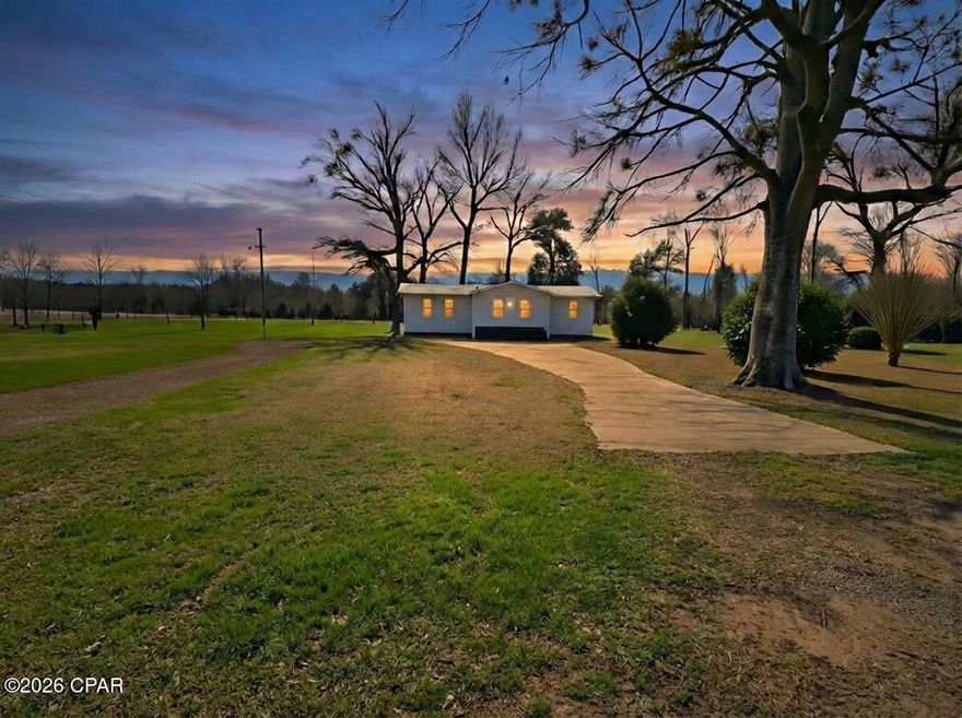 Discover Your Own Peaceful Country Retreat!
Escape to this charming 3-bedroom, 2-bathroom home nestled on a generous 5-acre parcel—the perfect blend of comfortable living and wide-open space. Imagine mornings with coffee on the expansive full-length screened-in back porch, where gentle breezes and peaceful views replace city noise. Whether you're relaxing with a book, hosting barbecues, or simply soaking in the quiet, this porch becomes your go-to outdoor sanctuary year-round—no bugs, just bliss.
The property offers incredible versatility with partial fencing ideal for pets, gardening, horses, or future expansion. Enjoy the security and convenience of two wells, providing reliable water independence for the home, irrigation, or whatever your lifestyle demands.
Inside, the thoughtfully designed layout includes an open floor plan with a bonus add-on living space featuring a raised ceiling that creates an airy, open feel. There is a large master suite with a tile shower and walk-in closet.  Recent improvements include vinyl plank flooring, vanities, interior and exterior paint,  screen and screen doors on back porch, hot water heater, and steps. A stove is soon to be included and installed.  
This isn't just a house—it's a lifestyle upgrade on rare acreage, offering privacy, room to roam, and endless possibilities. Whether you're seeking a forever home, a hobby farm starter, or a serene escape from the everyday hustle, this property delivers space, serenity, and value.
Call today to schedule a showing to your new home.