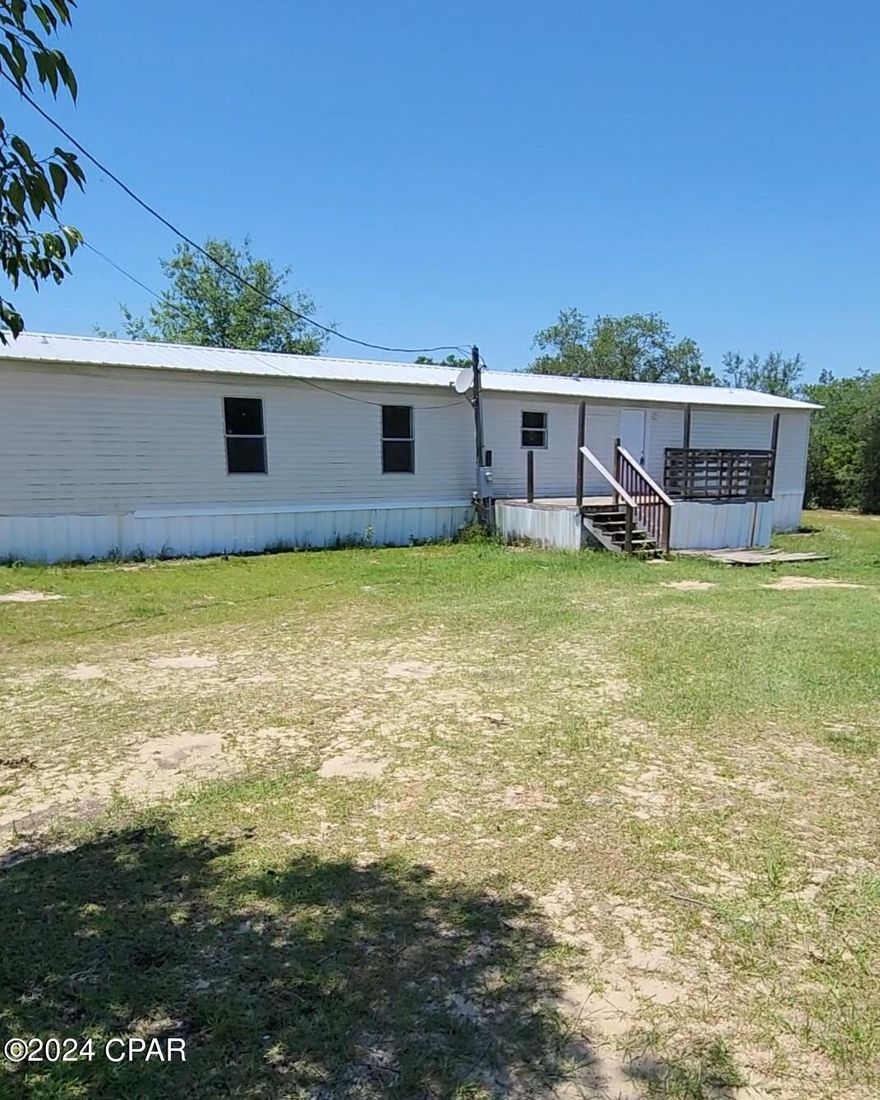 Motivated seller, Bring cash offer for quick closing. Seller will accept reduced price of $82,000 for Cash offer. Contact Agent today. This 3 Bedroom 2 Bath  1.140 sqft home has just been Beautifully upgraded. Sitting in a very quiet, yet growing area of Bay County. Sitting on a full Acre gives you the room to enjoy your own oasis of serenity. 
With Grocery store, Gas station, and weekend Farmers Markets close by, You can call this Home. Shopping is just 30 minutes away. Beaches are less than an hour away.
Contact Agent for viewing of this spacious home. All measurements are approximant, buyer to verify.
