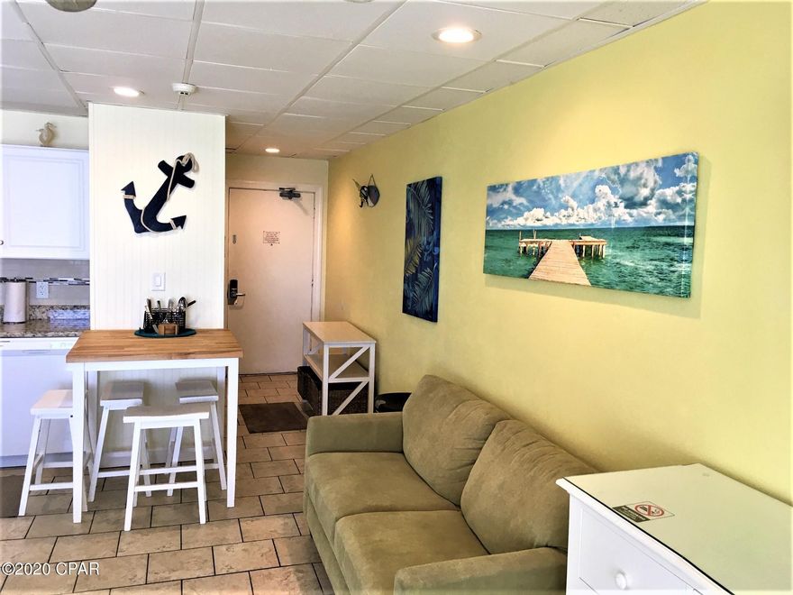 GULF FRONT CASH-FLOW UNIT. RIGHT ON THE BEACH WITH A BALCONY! If you're looking for a positive investment, THIS IS IT - High return on investment.  This remodeled unit is completely turn key. Buy it rent it cash the checks. Located close to Pier Park across from Gulf World, easy access to PCB PKWY  via Hill Ave. Close to restaurants and shopping.  Interior pictures is a few days.