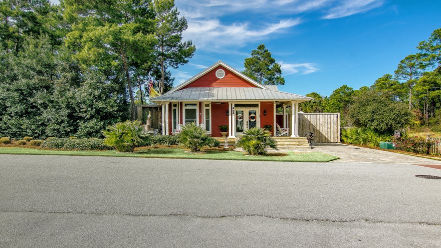 Prepared to be wowed upon entering the double glass front doors of this immaculate, warm, and welcoming bungalow. The front of the home is enhanced by ribbon around pavers and is the only home in this private gated community to have this feature. The meticulous craftsmanship of this home can be seen from top to bottom, making it ideal for the discerning buyer. It is immediately evident that no attention to detail was overlooked in the construction of this move-in ready beauty.

The open living/dining and kitchen area highlights beautiful tile floors, custom crown moulding and custom wood blinds. This home features metal roofing, custom moulding, floor-to-ceiling and transom windows, solid wood doors, recessed lighting and custom wood blinds throughout.  Kitchen/dining/living combo is 22X16 LOTS 55 AND 56 ARE INCLUDED IN ASKING PRICE OF &250,000.00 The kitchen is equipped with beautiful beadboard cabinets, stainless steel refrigerator/freezer, self-cleaning oven, built-in microwave, dishwasher and granite countertops with additional bar seating.
The carpeted master bedroom has an adjoining master bath with tile floors, deep tub with tile surrounded shower and two pedestal sinks. Two additional carpeted bedrooms have custom wainscoting with beadboard walls on the bottom. The second bath has a deep tub with tile surrounded shower tile floor and granite countertop. All bedrooms have oversized closets and there is a laundry closet off the hallway.
Treated 2X6 wood porches and decks surround the home and the property is insured privacy with an 8' wood fence. 
If you are looking for a quaint immaculate cottage-chic home surrounded by serenity, this is the place for you! This is one that you have to see to believe!! Lot 55 is included with the sale and purchase.