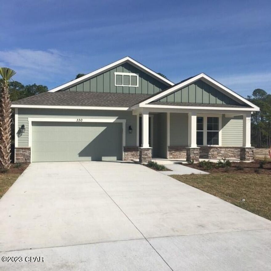 Welcome to 330 Blue Sage Road in the Whisper Dunes community in Panama City Beach, just minutes from Pier Park to the East and 30A to the West. This stunning home features an open floor plan with tile flooring throughout the main living areas, carpeting in the bedrooms and tile in the baths with granite countertops. A beautiful tile backsplash and granite countertop accent the white cabinetry in the Kitchen which has a breakfast bar, pantry, stainless steel appliances including a refrigerator, electric range, microwave, dishwasher and disposal. A large breakfast/dining area is located to the rear of the home. Two secondary bedrooms share a hallway full bath, and the primary bedroom features a large walk-in closet, an ensuite bath with a large shower and a separate soaking tub. The beautifully open floorplan with 10' ceilings and 8' doors also features a spacious laundry room and a two-car garage with additional storage shelving plus attic storage. A screened in rear porch with a view to nature and covered front porch offer space for outdoor enjoyment. The rent includes lawncare which is provided by the HOA, plus you will have access to the beautiful community pool and cabana.