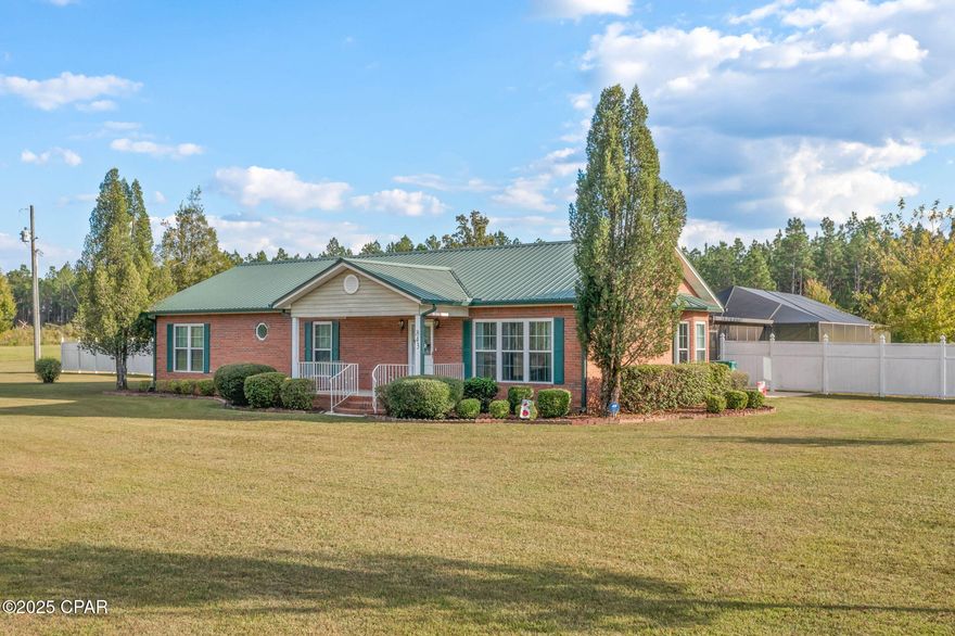 Nestled on approximately 7.8 acres along the sought-after Clayton Road, this charming brick home offers a blend of comfort and functionality. The spacious master suite includes dual sinks and convenient access to the laundry area. Additional bedrooms are connected by a Jack and Jill bathroom, ideal for family living. The open concept living, kitchen, and dining areas are enhanced by cathedral ceilings, creating an airy and inviting atmosphere. Step outside to enjoy the enclosed inground saltwater pool, a spacious 60x40 barn, covered front porch, and a screened-in back porch perfect for year-round relaxation. The paved driveway, beautifully lined with maple trees, adds a picturesque touch to the property.