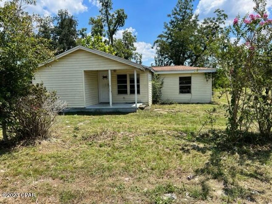 Beautiful lot in Southport that is over an acre! Value is in the land, however, there is a 3 bedroom 1 bathroom home on the property that needs work and would be a great investment opportunity! Septic and well onsite, seller does not warranty, being sold AS IS. Bay County Utilities stated public water is available, tap fees will have to be paid. Buyer to complete due diligence/inspections prior to submitting offer.