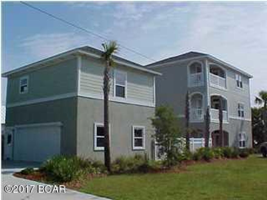 What a Happy, Cumfy Beach House! This 3 br, 3.5 bath is situated on a private street within walking distance to the beach. The carriage house has been finished into a 1br apartment and is currently rented for $950.00 per month. The first floor of the main house features a spacious kitchen and dinning combo, a half bath, plenty of storage and a large living room adorned with 9 ft ceilings crown molding and patio doors that open to your own private kidney shaped pool. The second floor has two spacious bedrooms each with their own private bathrooms and a balcony. On the top floor you have a spacious loft, master suite and a balcony that boasts panoramic views of the Panama City Beach skyline. Call your favorite Realtor today for your own private showing.