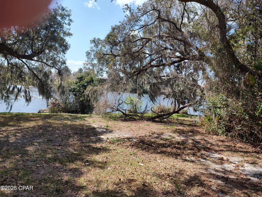 Beautiful lot with mature trees. Situated on a paved street. Older shed on property.